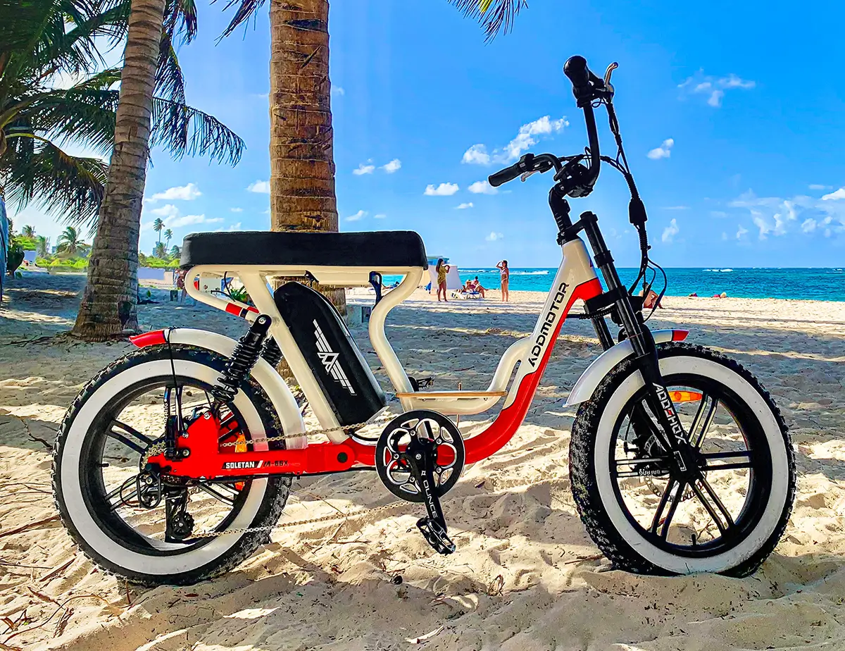 riding addmotor cruiser electric bike on the sandy beaches