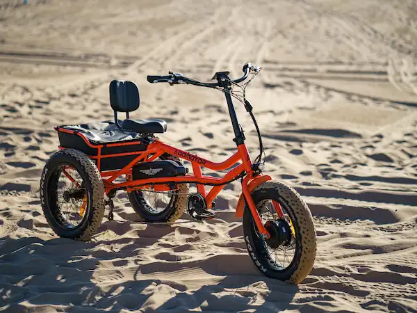 orange semi-recumbent trike on the beaches