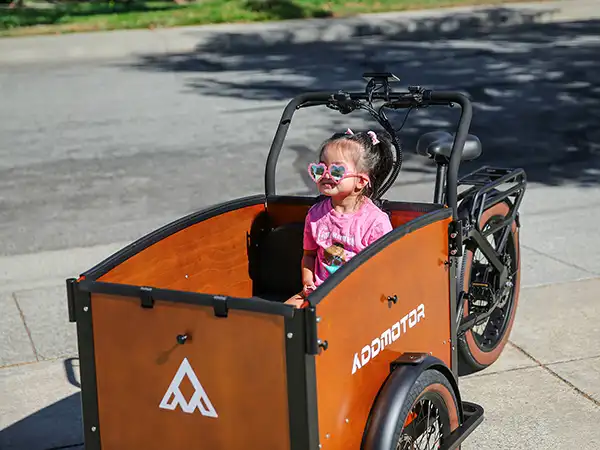 a liitle girl on E-325 2-front-wheel electric trike